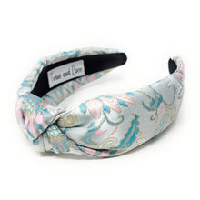 Load image into Gallery viewer, Floral patterned headband on a white background