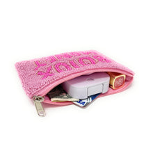 Load image into Gallery viewer, Pink zippered pouch with various items on a white background