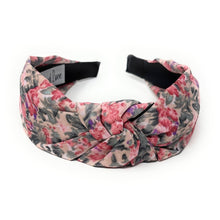 Load image into Gallery viewer, Floral headband with pink, purple, and dark green pattern on a white background. It features a central knot, creating a vibrant, stylish look.