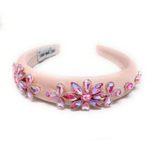Load image into Gallery viewer, Pink headband with floral embellishments on a white background