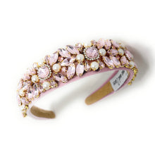 Load image into Gallery viewer, Pink jeweled headband adorned with sparkling pink gemstones and pearls on a soft pink fabric. Elegant, luxurious, and feminine design.
