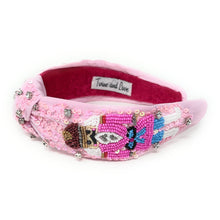 Load image into Gallery viewer, Pink nutcracker knot headband adorned with intricate beadwork, sequins, and rhinestones.