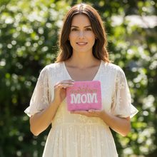 Load image into Gallery viewer, Woman holding a pink card with 'Happy Mother's Day' text outdoors.
