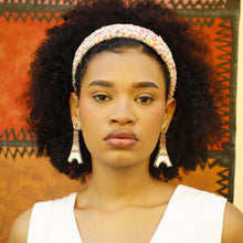 Load image into Gallery viewer, Elegant portrait featuring a vibrant confetti headband and beautiful Eiffel Tower-inspired earrings.