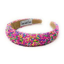 Load image into Gallery viewer, Bright pink confetti headband covered in colorful sprinkle-inspired beads for a playful and fun statement look.
