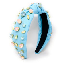 Load image into Gallery viewer, Woman wearing a light blue gemstone headband and vibrant multicolor parrot earrings with a green halter top.