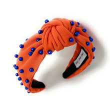 Load image into Gallery viewer, headbands for women, blue orange headband, handmade headbands,  orange blue top knotted headband, Go Gators Florida knotted headband, Florida university Headband, Go Gators headband, blue pearl headband, blue orange game day headband, football headband, jeweled headband, knotted jeweled headband, Florida football headband, Florida Gators knot headband, Gators Florida knot headband, pearly headbands, Orange headband, game day hair accessories, game day headband, football headbands, best selling items