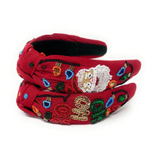 Load image into Gallery viewer, Red headband adorned with colorful beaded designs. The festive patterns create a cheerful, holiday-inspired look against a white background.