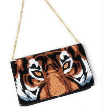 Load image into Gallery viewer, Artisan-crafted tiger face clutch with intricate seed bead embroidery and a bold, eye-catching design.