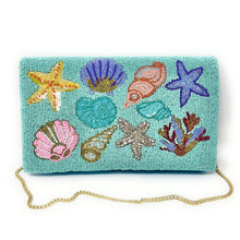 Load image into Gallery viewer, Colorful beaded clutch featuring shells, starfish, and coral on a turquoise background. The vibrant design conveys a lively, ocean-themed vibe.