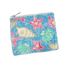 Load image into Gallery viewer, Beaded pouch with a beach theme, featuring colorful starfish and seashell patterns against a blue background. The pouch has a zipper on top.