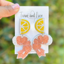 Load image into Gallery viewer, Whimsical shrimp and lemon beaded earrings designed with detailed embroidery for a unique seaside accessory.