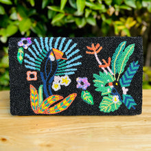 Load image into Gallery viewer, Handmade black statement clutch adorned with intricate beadwork showcasing tropical foliage, floral accents, and exotic garden-inspired designs.