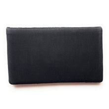 Load image into Gallery viewer, Black beaded evening clutch showcasing bright floral patterns in vivid shades of yellow, blue, red, pink, and purple.