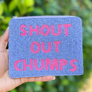 A beaded pouch with blue beads and bold pink text reading "SHOUT OUT CHUMPS" on the front. It has a zipper at the top and a playful tone.