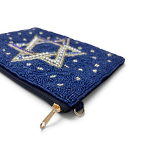 Load image into Gallery viewer, Side angle of a navy blue Star of David beaded pouch showcasing its intricate beadwork, zipper closure, and gold hardware.