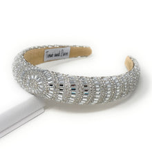 Load image into Gallery viewer, Elegant silver headband adorned with sparkling, intricate patterns and rhinestones, reflecting light. 