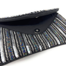 Load image into Gallery viewer, Black clutch with beaded detailing on a white background