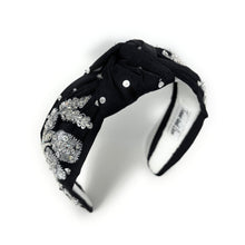 Load image into Gallery viewer, A black headband adorned with intricate silver floral embroidery and shimmering gemstones, conveying elegance and luxury.