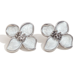 Floral earrings with silver accents on a white background