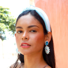 Load image into Gallery viewer, Chic summer look with a soft blue padded headband and jeweled statement earrings.