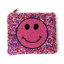 Load image into Gallery viewer, Cute beaded coin pouch with smiley face design against green background