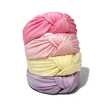 Load image into Gallery viewer, Four fabric headwraps stacked vertically on a white background, featuring pink, light pink, pale yellow, and lavender colors. Each wrap is knotted at the top.