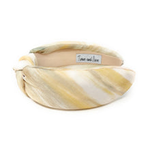 Load image into Gallery viewer, Trendy headband made of patterned fabric in light yellow and cream shades.