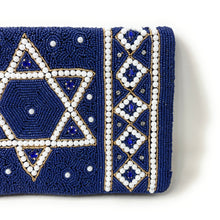 Load image into Gallery viewer, Close-up of royal blue beaded clutch featuring Star of David design and pearl detailing.