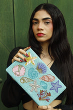 Load image into Gallery viewer, Elegant ocean-themed clutch bag with pastel seashell motifs and detailed bead embroidery, perfect for summer vacations and resort wear.