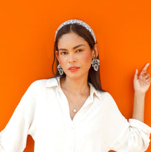 Load image into Gallery viewer, Elegant silver statement earrings paired with pearl headband and relaxed white shirt.