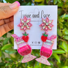 Load image into Gallery viewer, Pink cocktail glass earrings featuring sparkling sequins, beaded strawberry accents, and crystal flower stud tops.