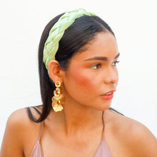 Load image into Gallery viewer, A stylish woman in a satin pink top, smiling and wearing statement earrings.
