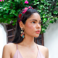 Load image into Gallery viewer, Colorful floral headband with vibrant embroidered blooms styled on a model outdoors.
