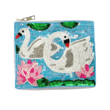 Load image into Gallery viewer, Hand beaded pouch with two white swans, pink flowers, and green leaves on a blue background. 
