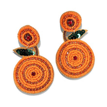 Load image into Gallery viewer, Orange fruit-inspired beaded earrings featuring circular seed bead patterns, sparkling red crystal centers, and green leaf accents.