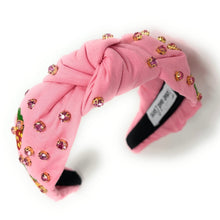 Load image into Gallery viewer, pink strawberry print headband with sparkling embellishments and matching strawberry statement earrings outdoors.