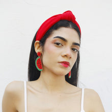 Load image into Gallery viewer, Woman wearing red knotted headband with watermelon beaded statement earrings.