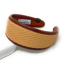 Load image into Gallery viewer, Tan and brown woven headband with textured pattern, lying on a white surface. The headband exudes a casual, earthy elegance.