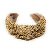 Load image into Gallery viewer, A woven straw headband featuring a twisted knot design, with a soft beige lining. The label inside reads &quot;Time and Love,&quot; set against a white background.