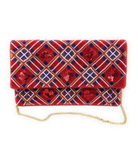 Load image into Gallery viewer, Red patterned clutch bag with gold chain on a white background