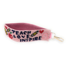 Load image into Gallery viewer, Pink keychain with 'Teach Love Inspire' text on a white background
