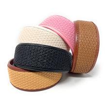 Load image into Gallery viewer, Collection of wide woven headbands in black, ivory, pink, tan, and camel, featuring textured basket-weave designs with faux leather trim.