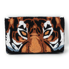 Load image into Gallery viewer, Hand-beaded clutch featuring a striking tiger face design in black, white, orange, and tan seed beads.