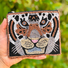 Load image into Gallery viewer, Beaded pouch depicting a tiger&#39;s face, made with intricate brown, black, white, and blue beads. The design is vibrant and expressive, with a gold zipper.