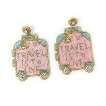 Load image into Gallery viewer, Close-up of pink suitcase earrings with intricate beadwork and lettering
