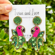 Load image into Gallery viewer, Handcrafted flamingo headband featuring vibrant pink beadwork, tropical leaf accents, and sparkling embellishments for a bold statement look.