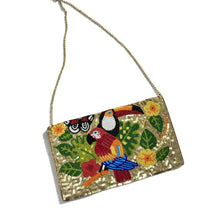 Load image into Gallery viewer, A gold sequined clutch bag with a tropical parrot and toucan beaded design on the front, featuring a delicate gold chain strap, set against a plain white background.