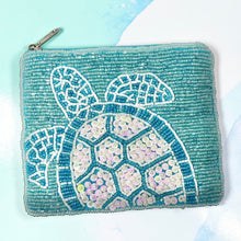 Load image into Gallery viewer, Hand-beaded turquoise coin purse with detailed sea turtle motif and textured finish.