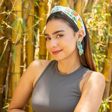 Load image into Gallery viewer, Beaded statement earrings featuring turquoise sunglasses with floral accents and sparkling green crystal star tops.
